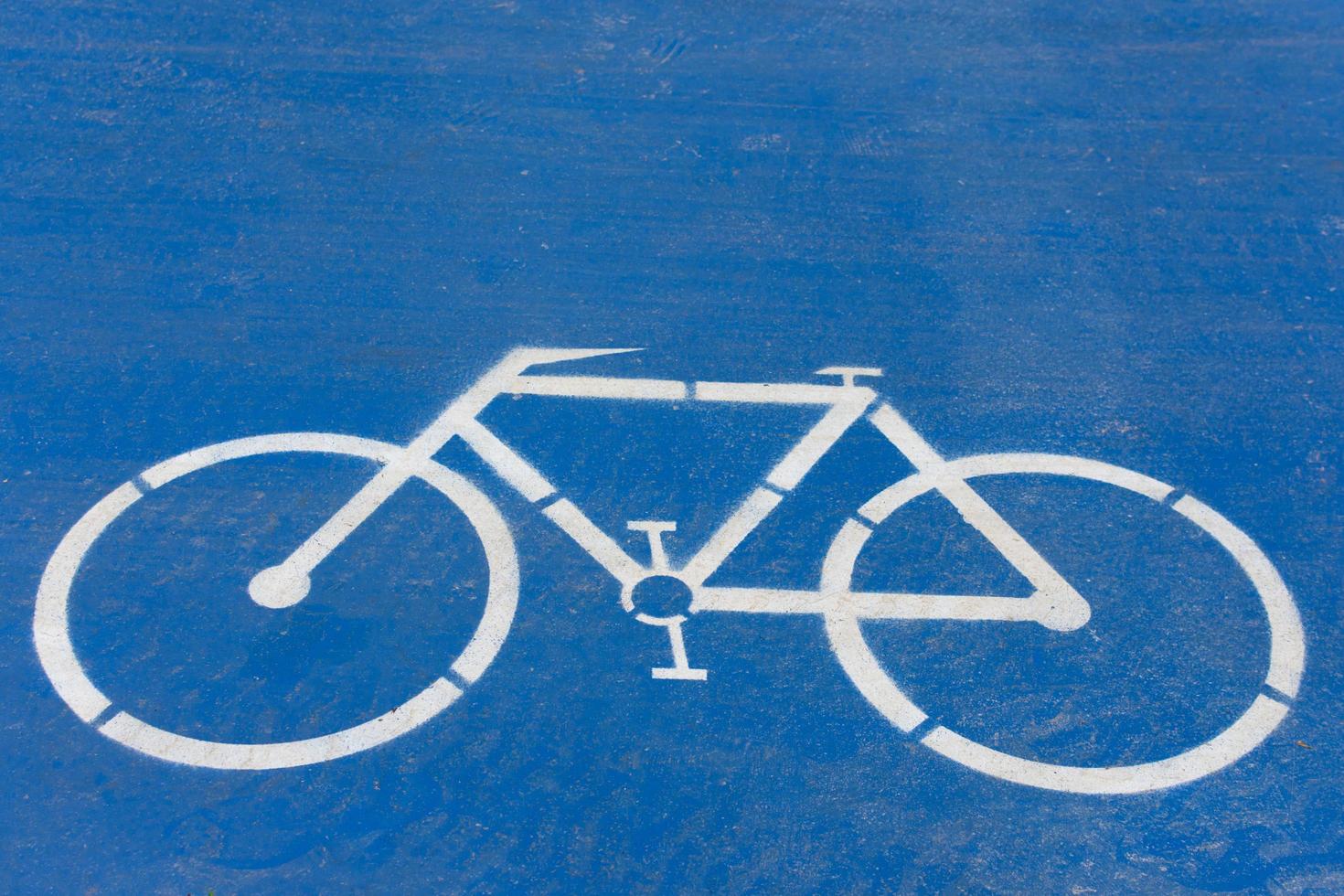 simbolo della bicicletta su sfondo blu foto