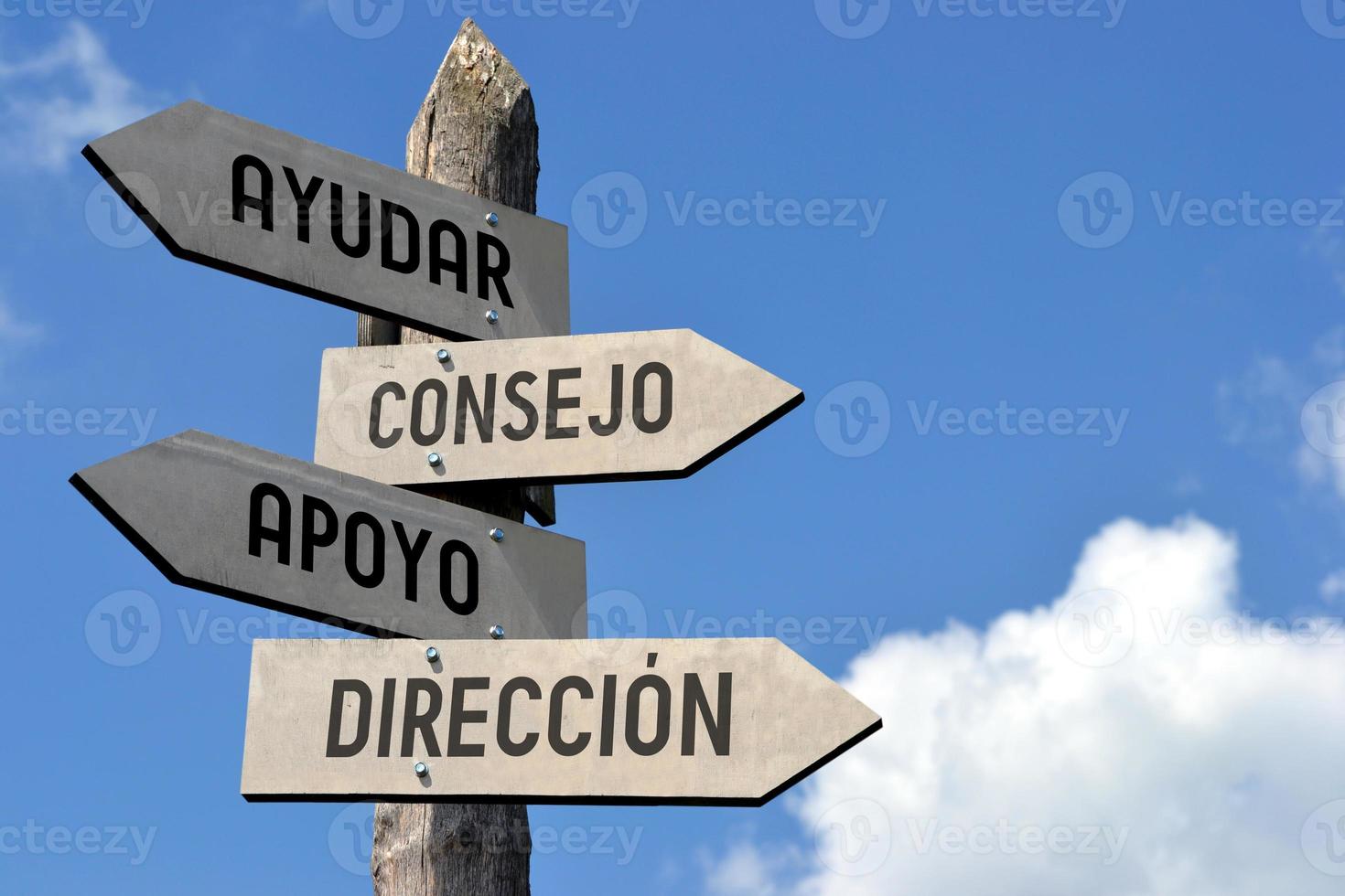 aiuto, sostegno, consiglio, guida nel spagnolo - di legno cartello stradale foto