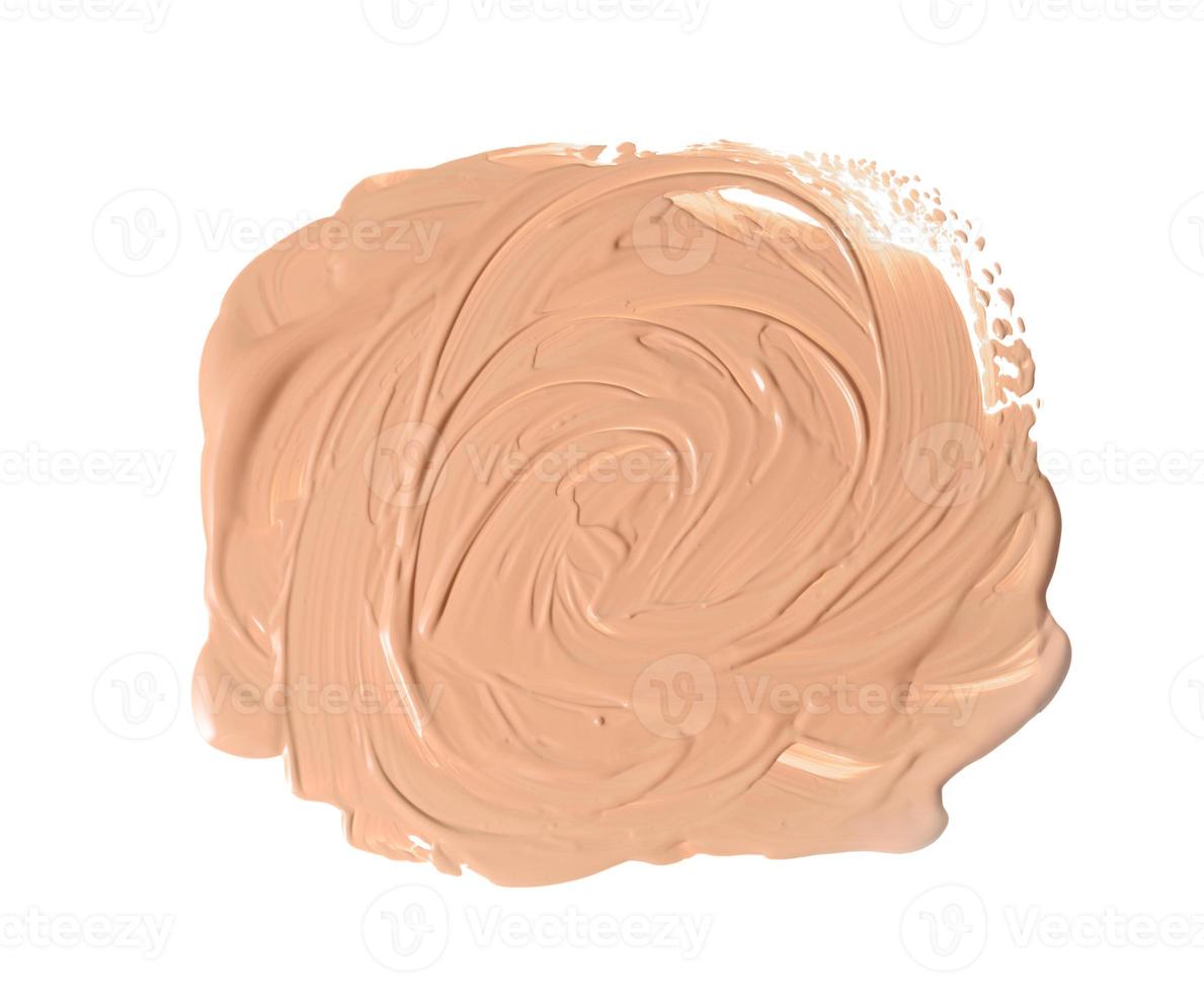 il giro swatch di beige liquido correttore viso crema su bianca isolato sfondo foto