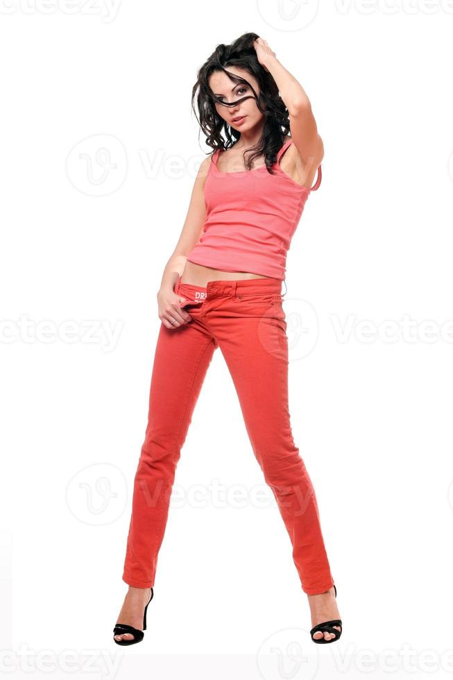 bellissimo giovane brunetta nel un' rosso jeans foto