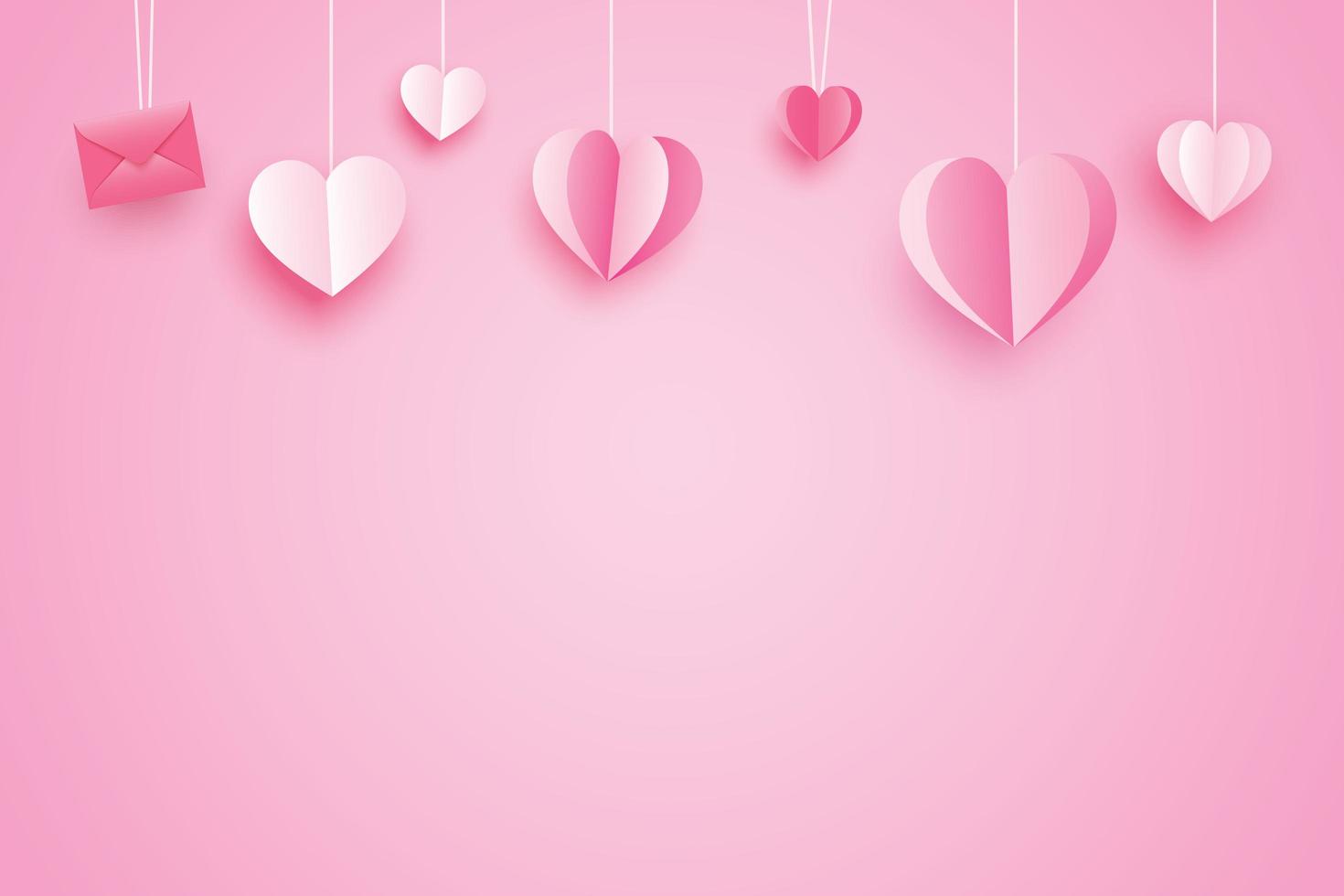 cuori di carta rosa su sfondo rosa per lo sfondo di San Valentino foto