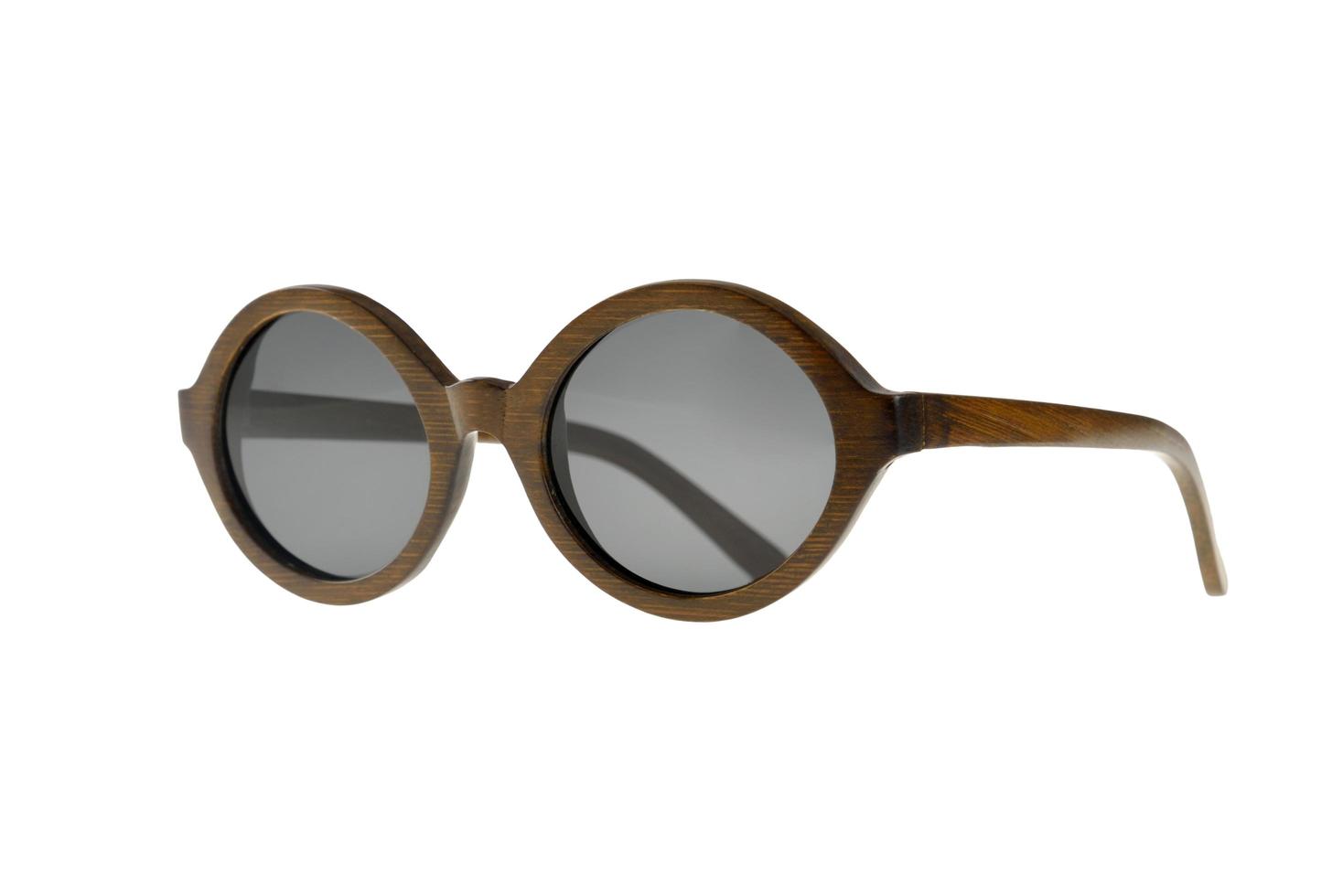 occhiali da sole rotondi con montatura in legno foto