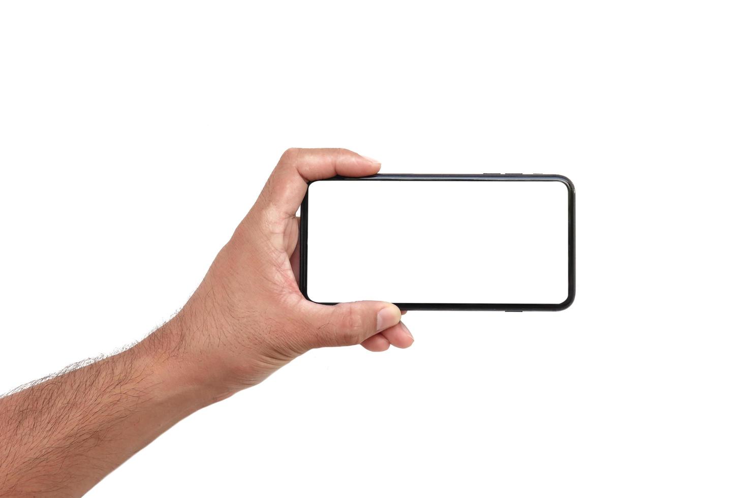 la mano tiene lo schermo bianco, il telefono cellulare è isolato su uno sfondo bianco con il tracciato di ritaglio foto