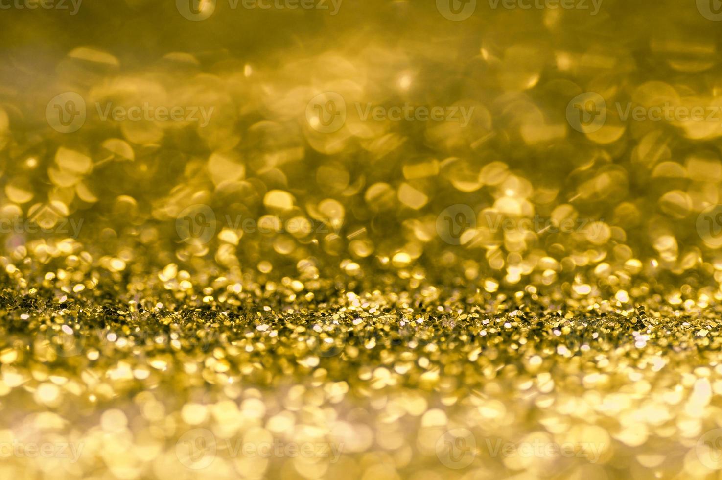 oro scintillante e sfondo bokeh foto