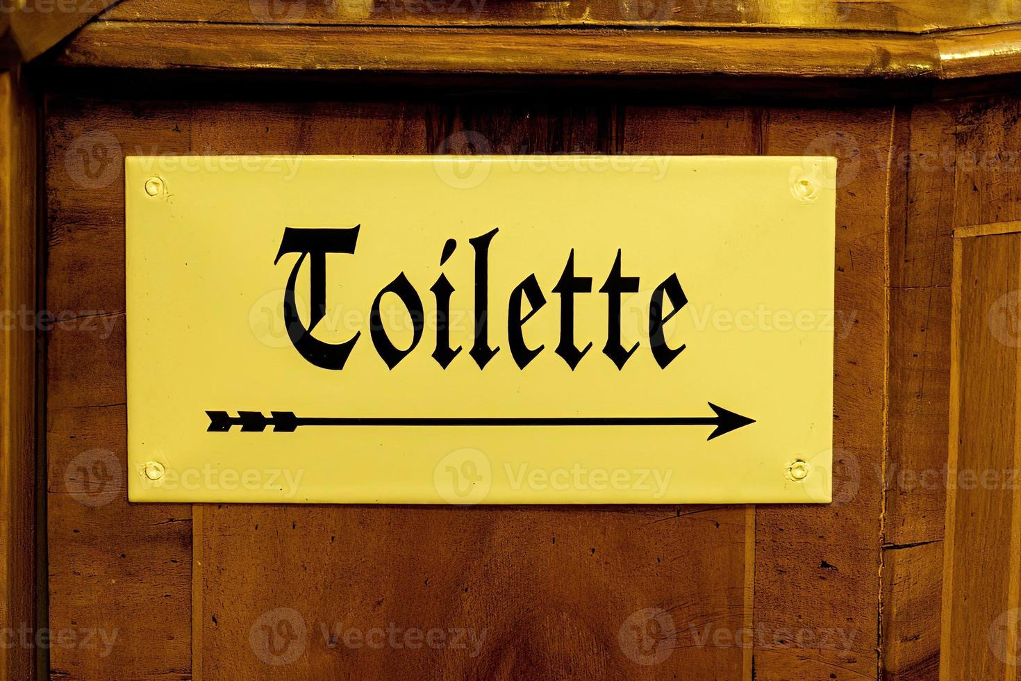 Toilette bagno freccia cartello su rame vecchio stile Tedesco foto