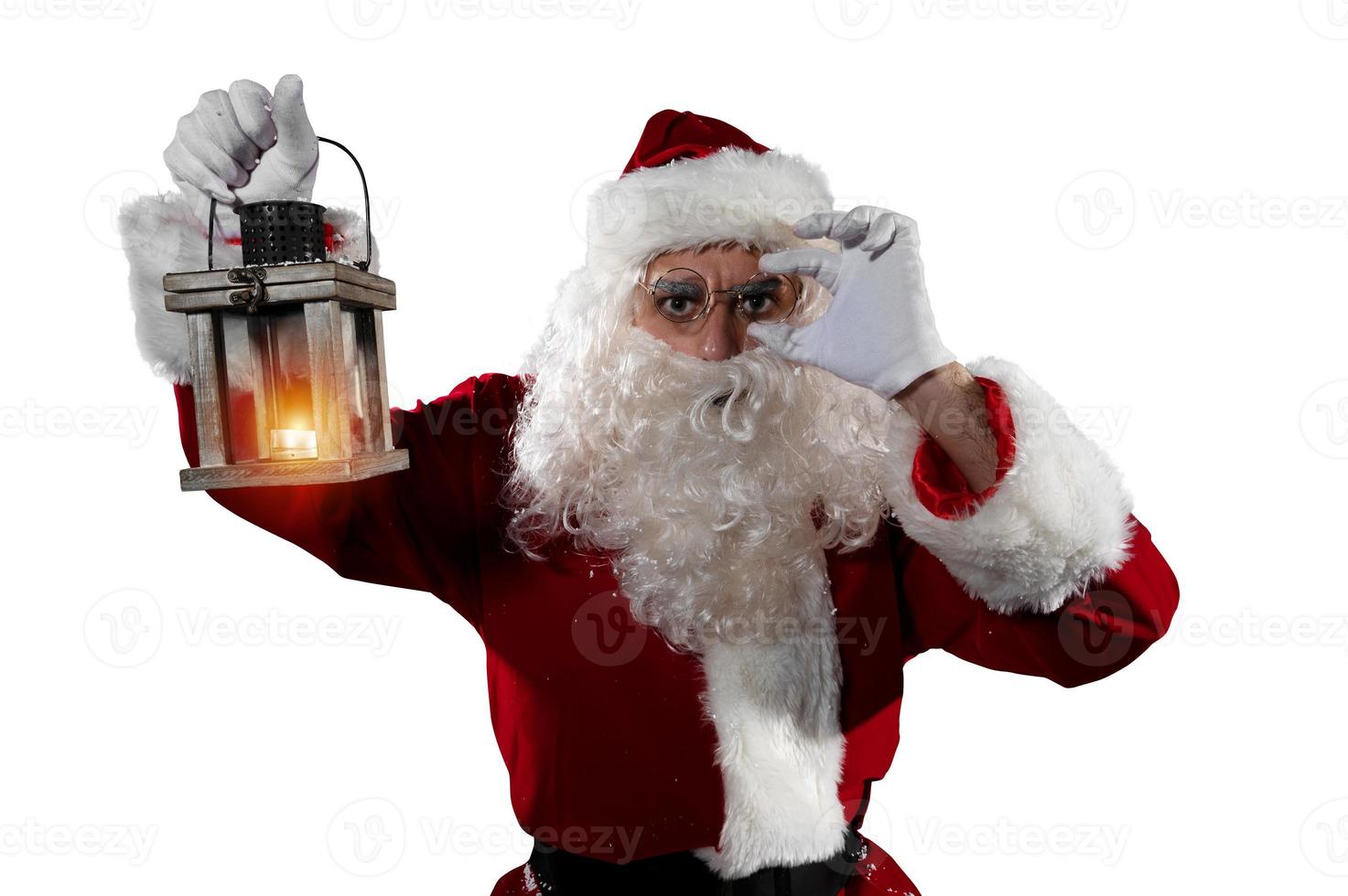 dubbioso Santa Claus con un' Vintage ▾ lanterna foto