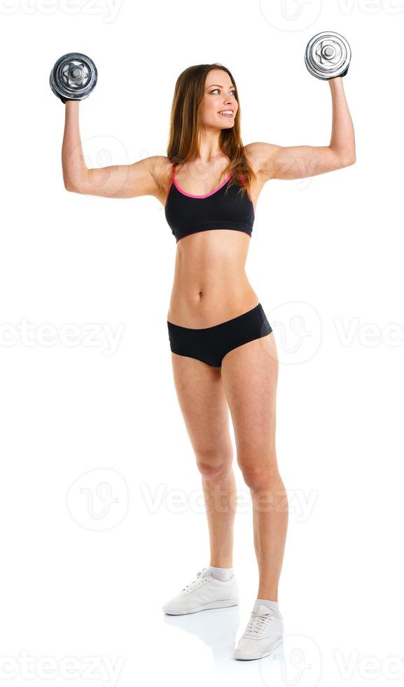 contento atletico donna con manubri fare sport esercizio, isolato su bianca foto