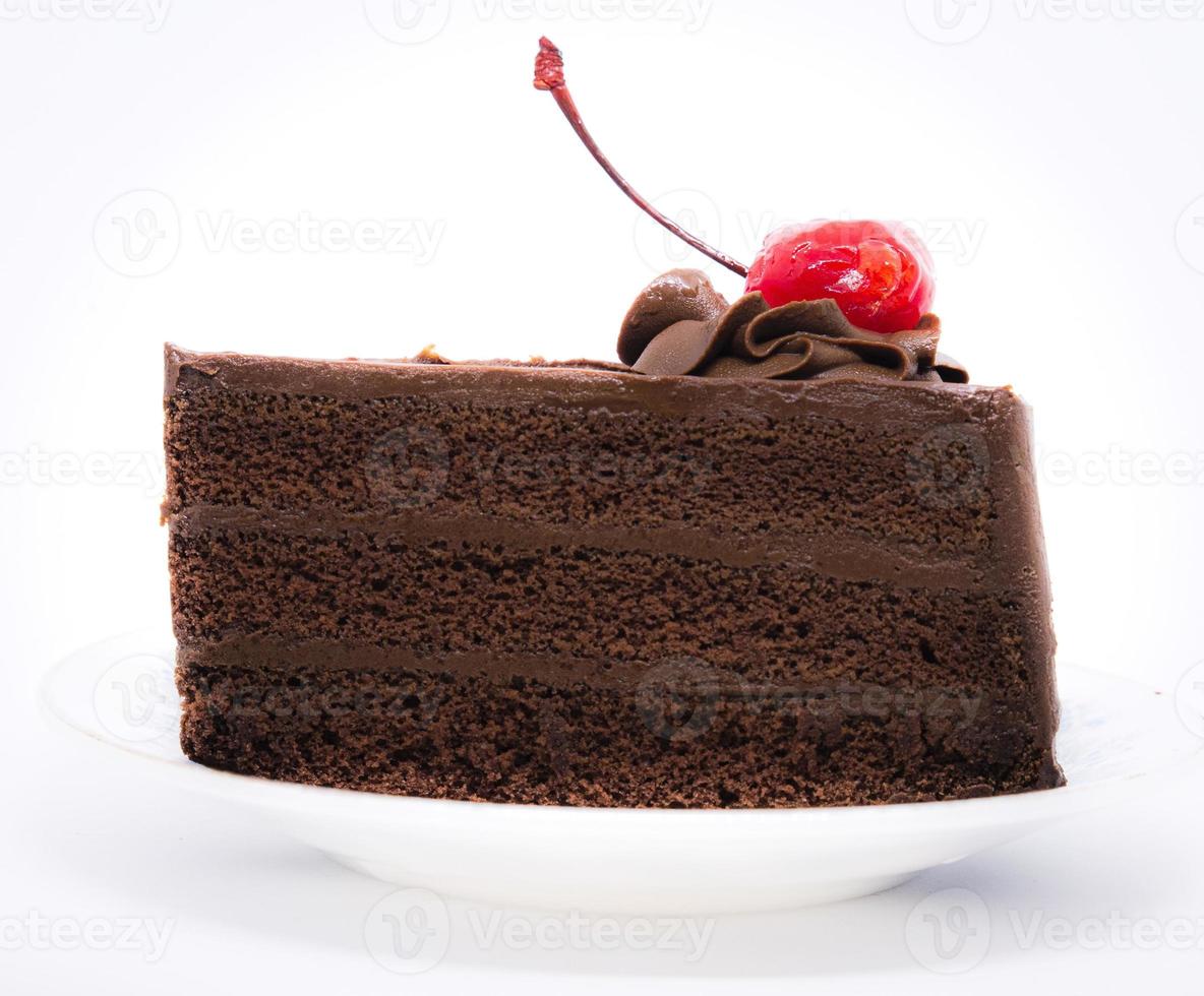 torta al cioccolato con ciliegina sulla torta foto