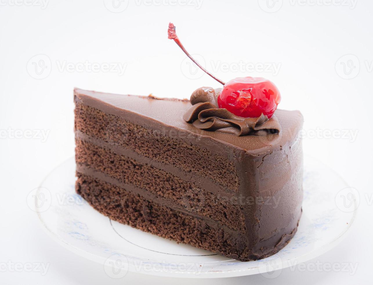 torta al cioccolato con ciliegina sulla torta foto