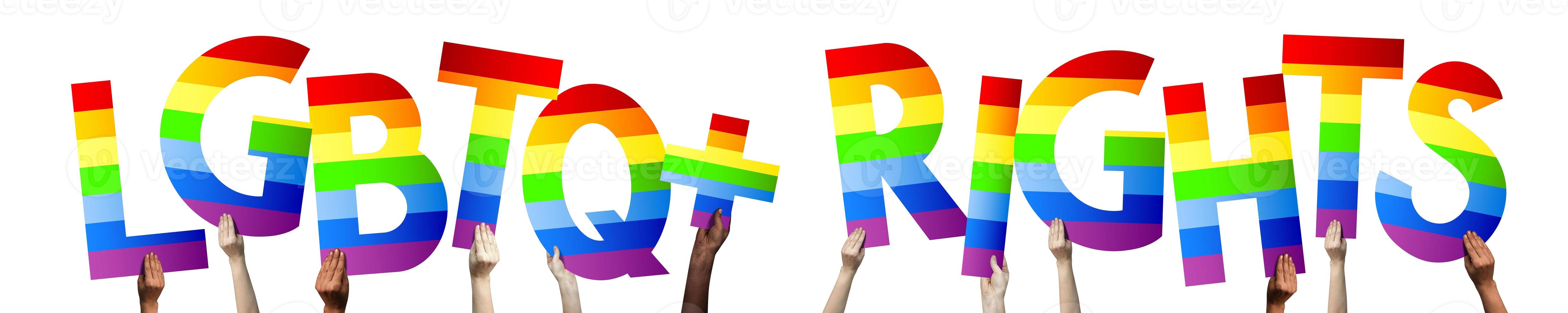 LGBTQ diritti bandiera - umano mani Tenere colorato lettere foto