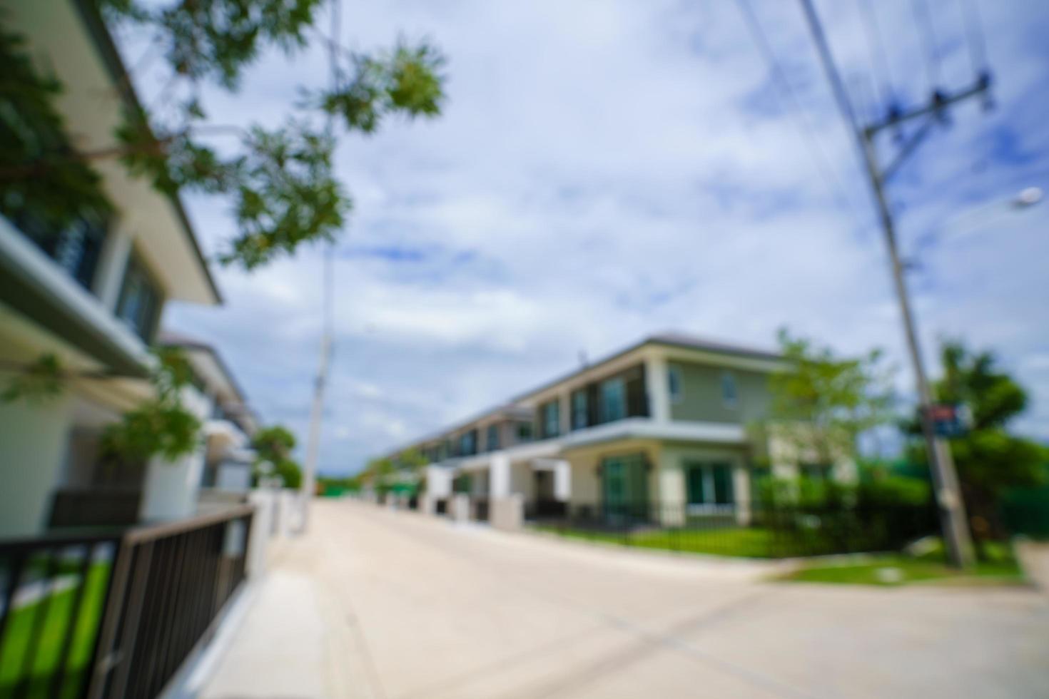 sfocatura astratta e sfondo bokeh di quartiere residenziale foto