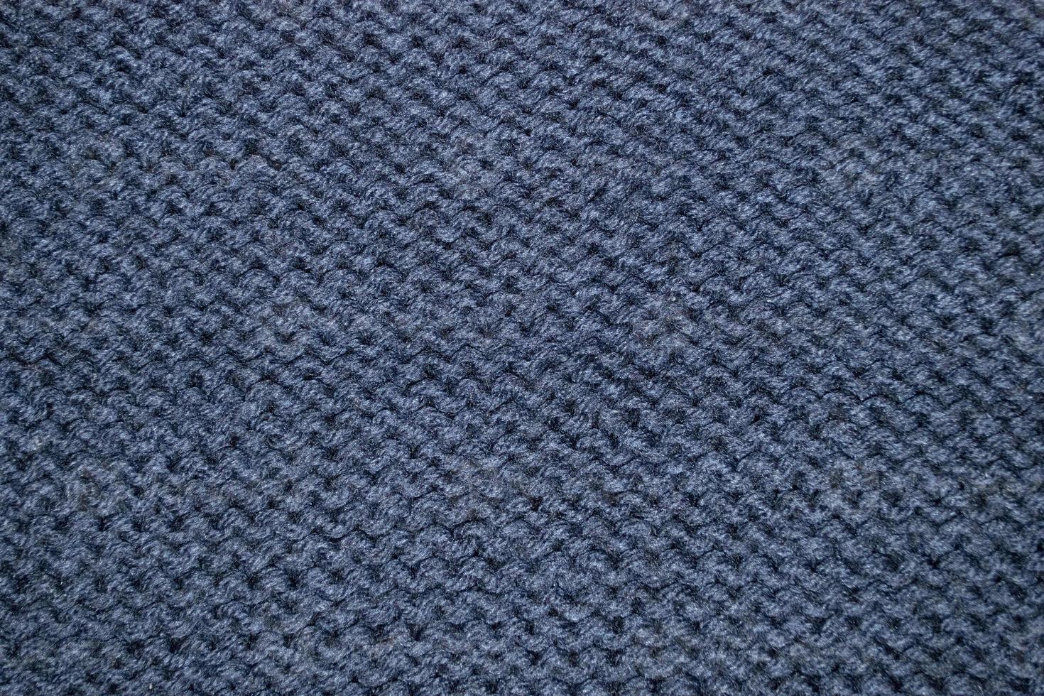 un' blu a maglia maglione con un' modello di il intrecciata modello foto