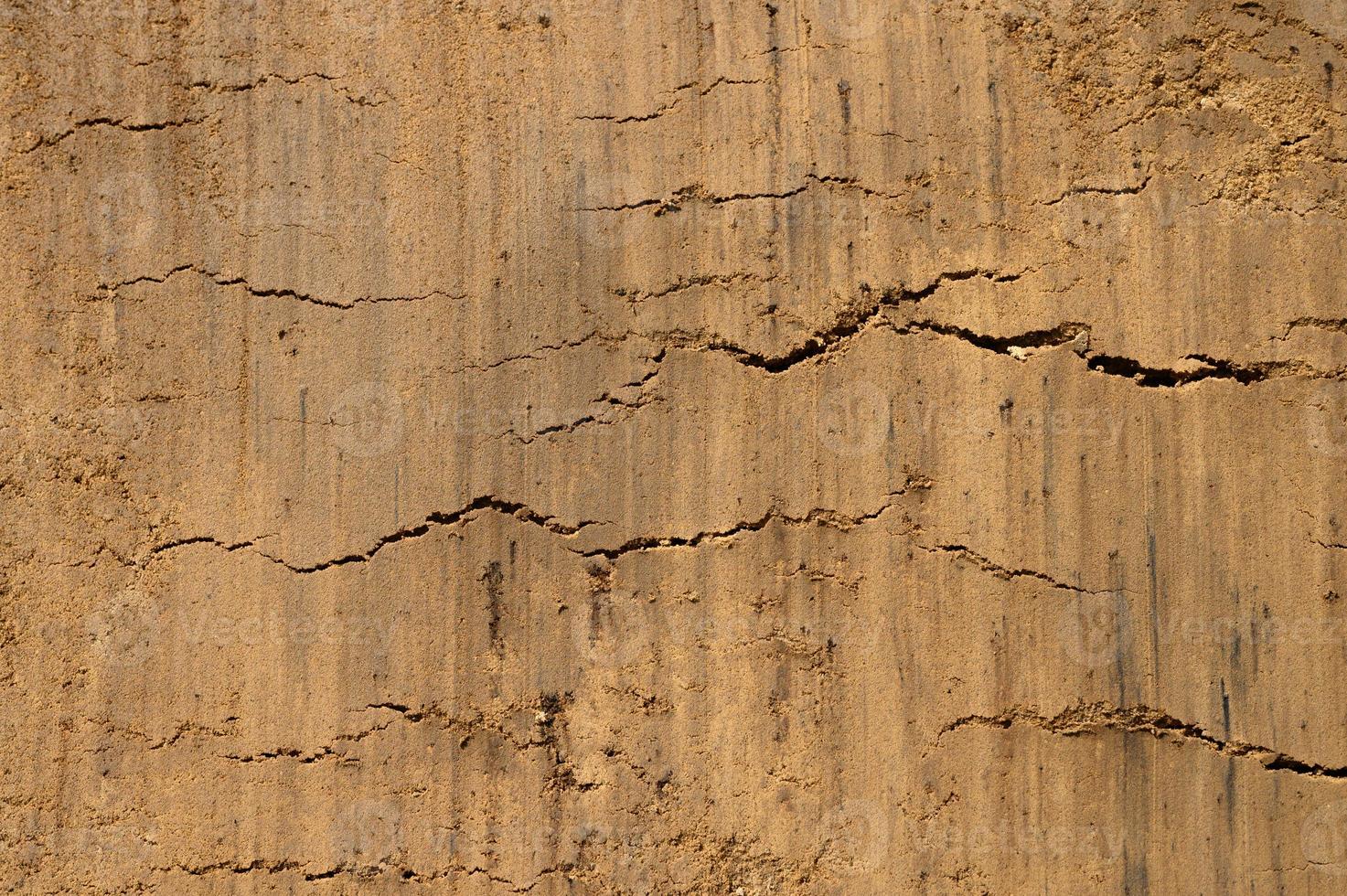 trama di sfondo dalla superficie sciolta del suolo di sabbia e terra foto