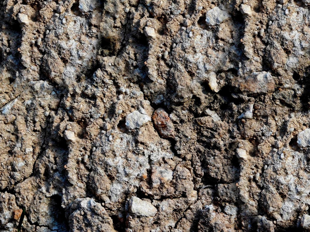 primo piano del muro di pietra o roccia per lo sfondo o la trama foto