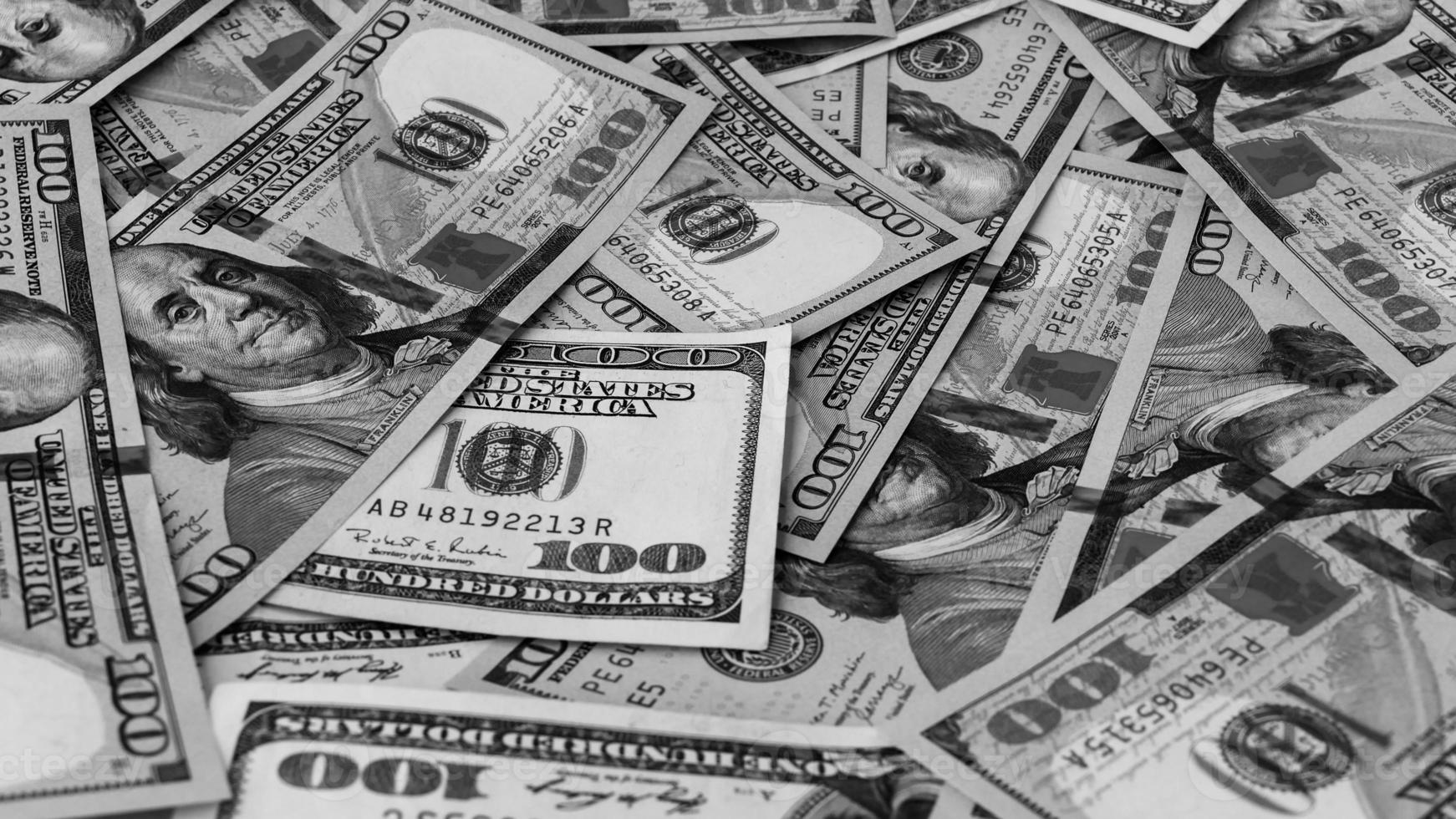 nero e bianca sfondo di noi moneta banconote finanziario concetto i soldi sfondo centinaio dollaro fatture foto