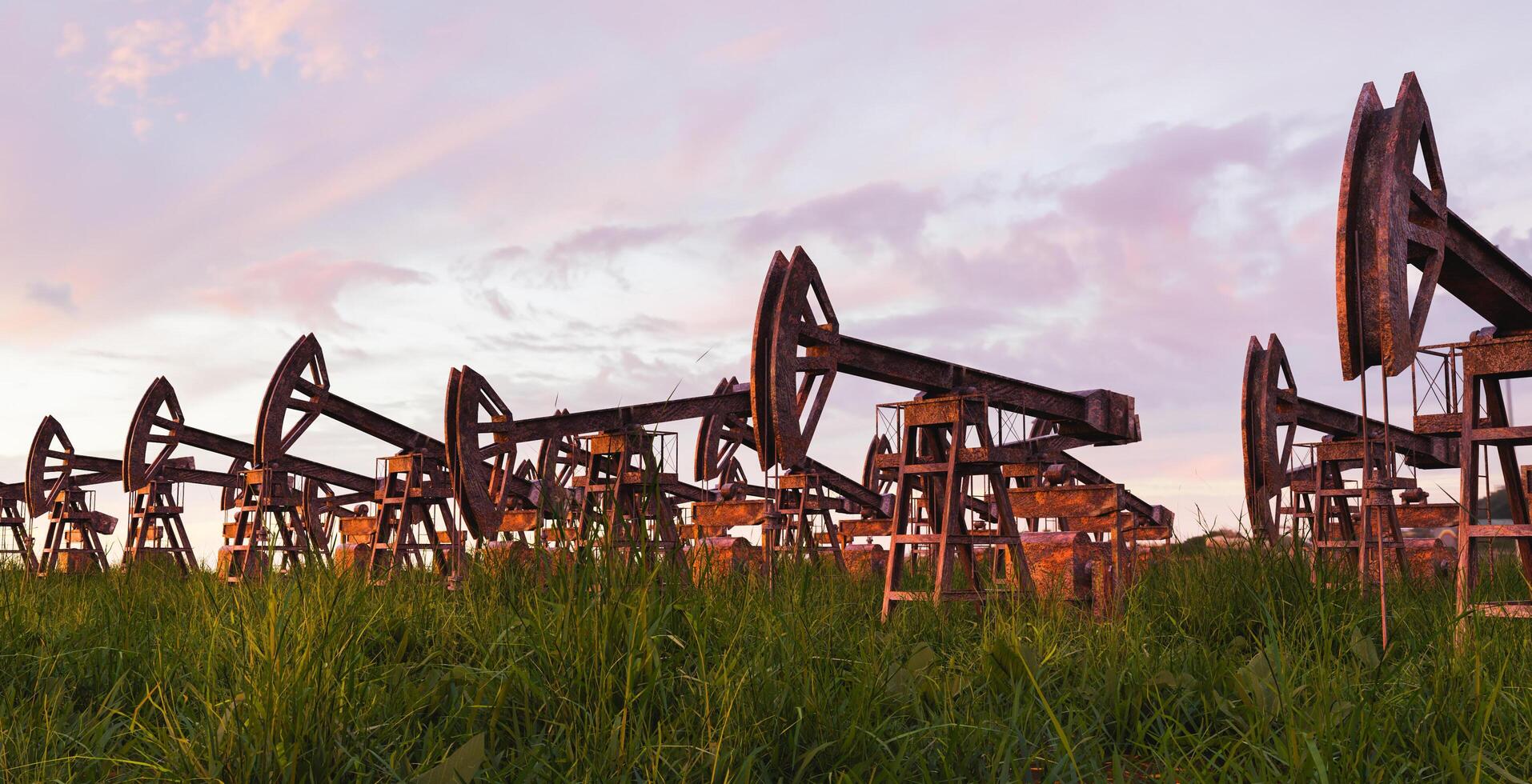 paesaggio con pompe dell'olio arrugginite e abbandonate e l'erba che cresce intorno ad esso con il tramonto, rendering 3d foto