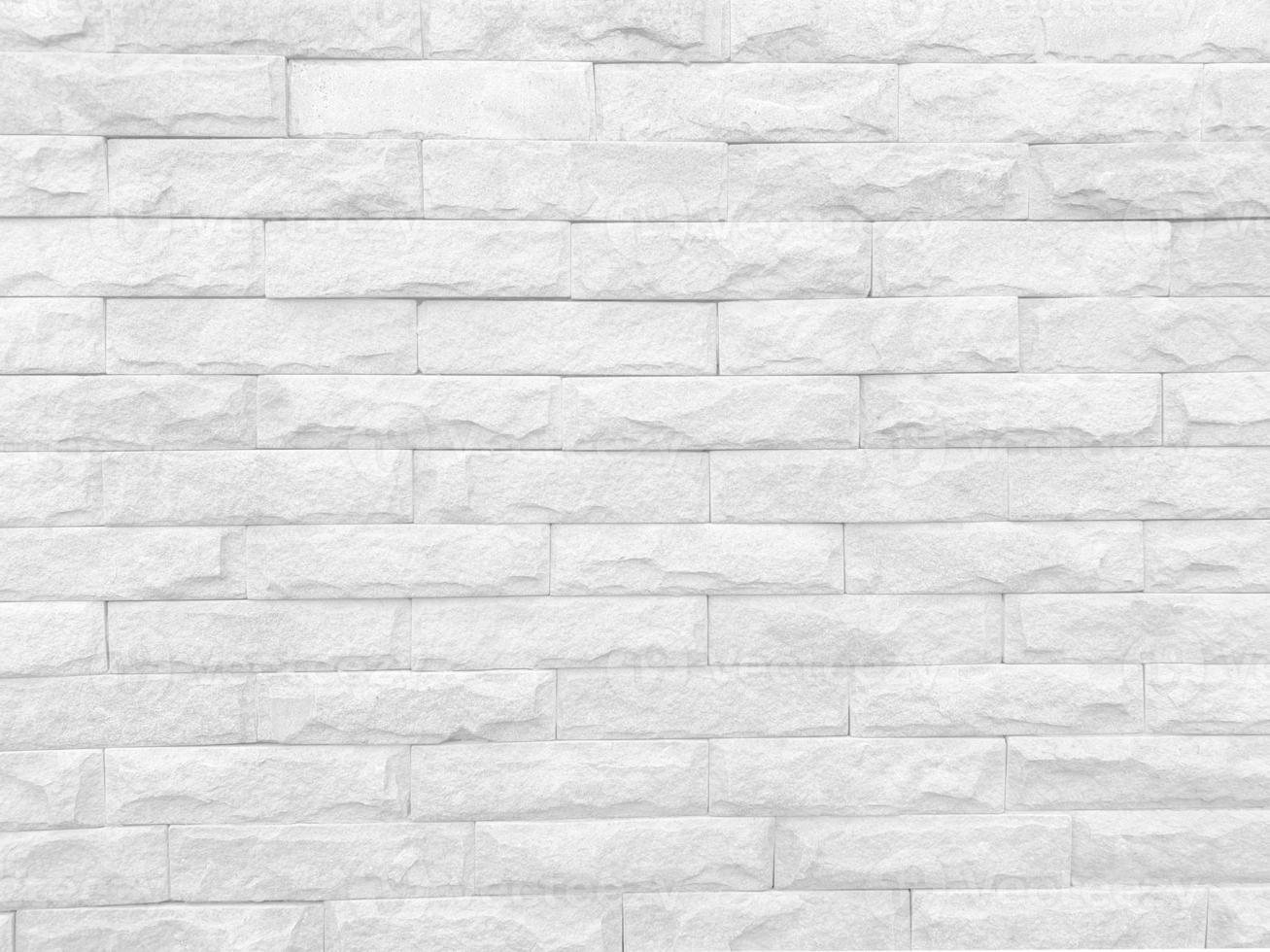 struttura senza cuciture del muro di pietra bianca una superficie ruvida, con spazio per testo, per uno sfondo. foto