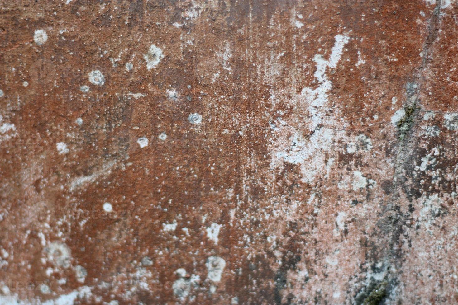 foto di rosso parete struttura con cemento su il parete