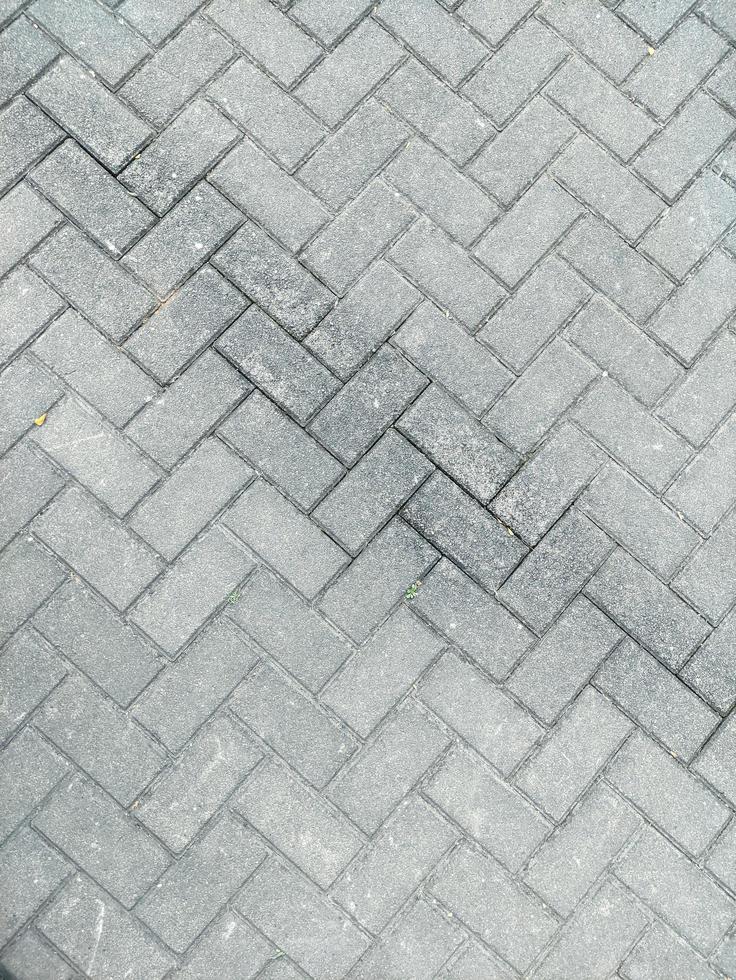 pietra bloccare pavimentazione. pavimentazione lastre di grigio colore come un' sfondo. struttura di pavimentazione bloccare. foto