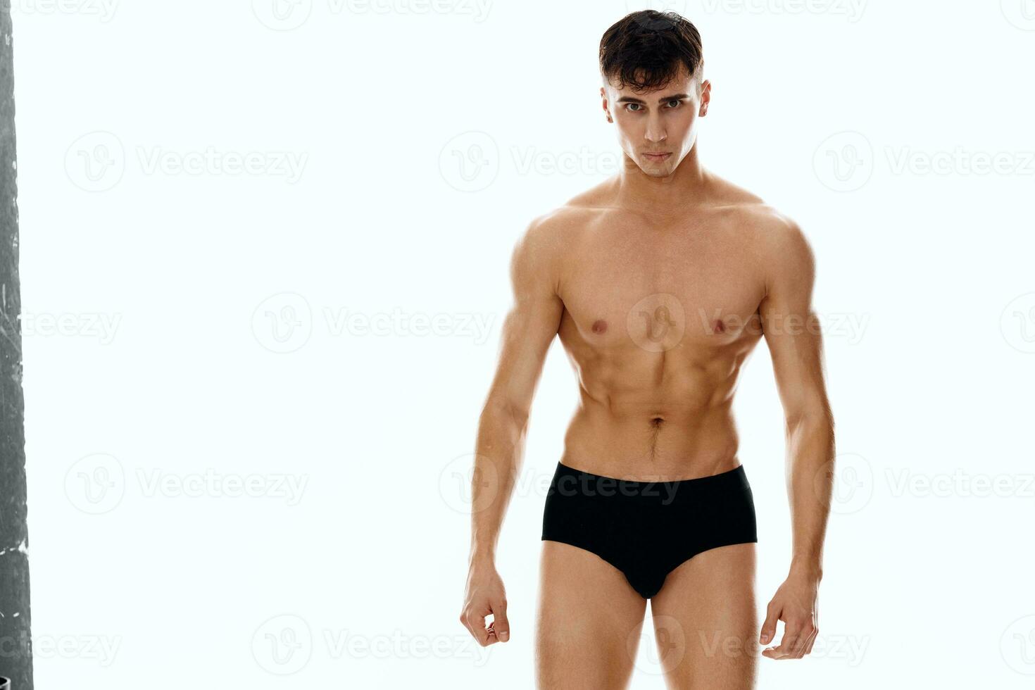 sportivo uomo con nudo corpo nero mutandine leggero sfondo foto