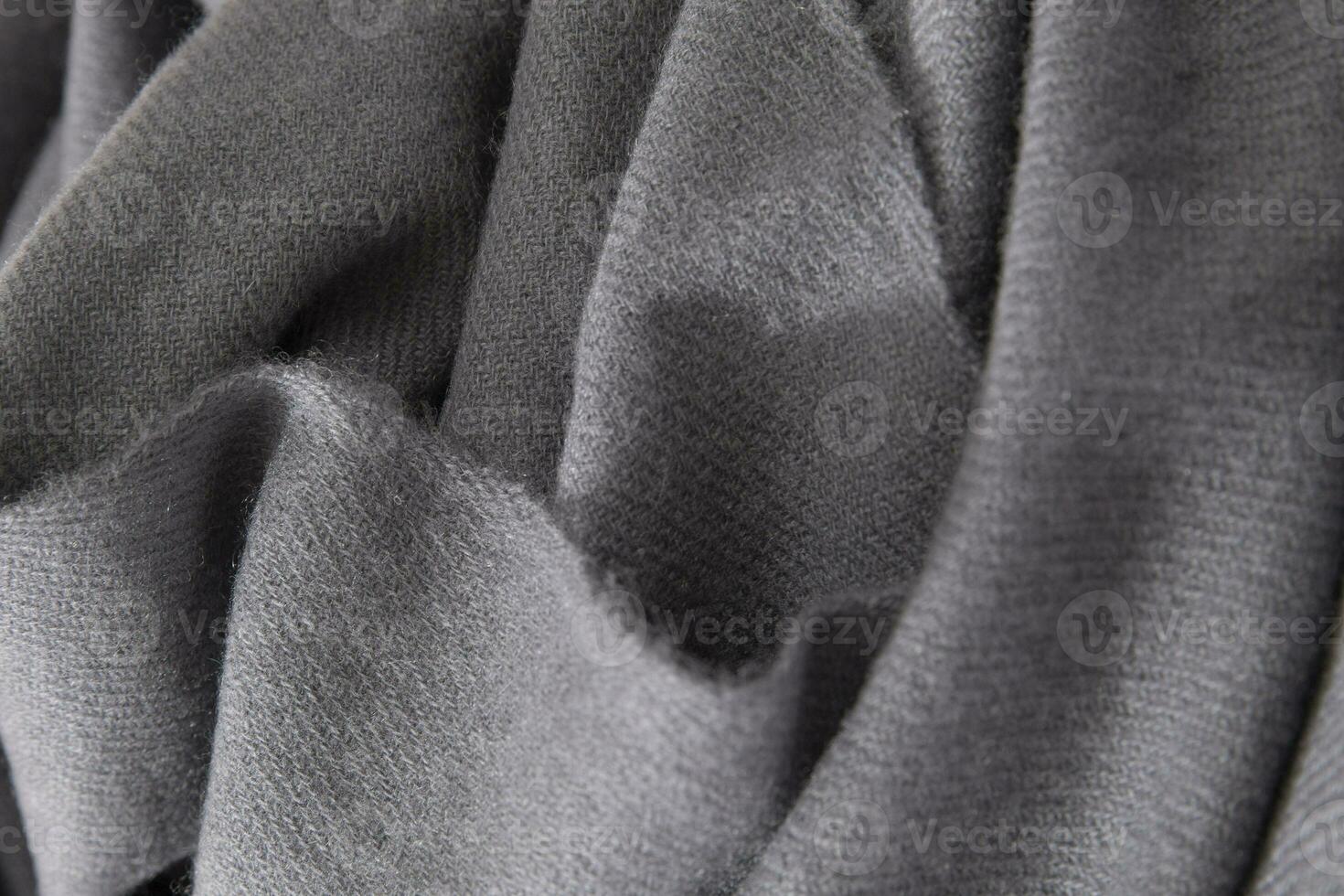 naturale lana grigio tessuto. cachemire, lana vergine. struttura di naturale lana tessuto. maglieria. foto