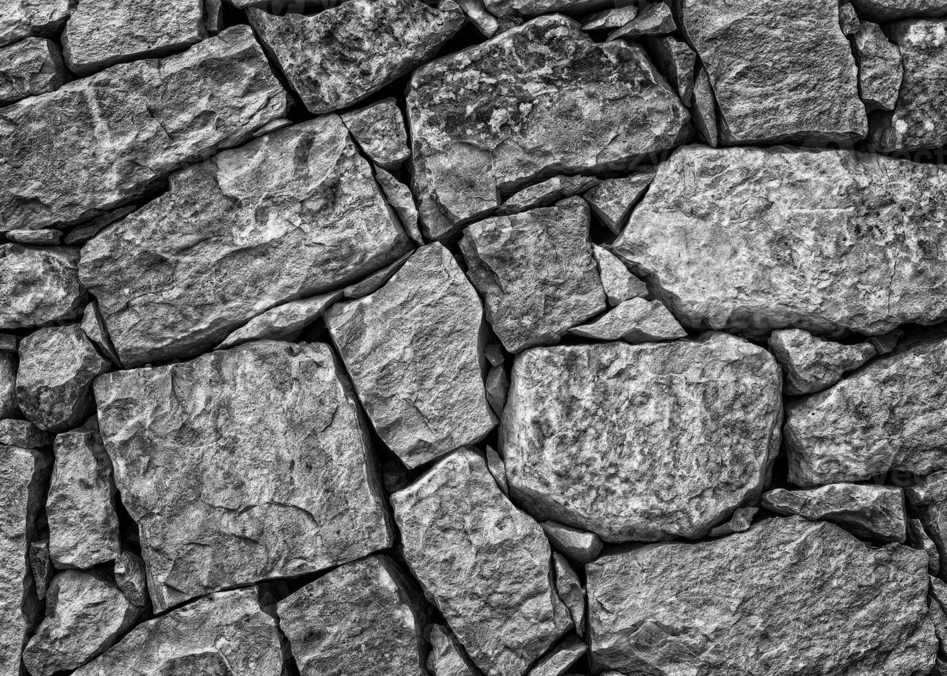 struttura di un muro di pietra. fondo di struttura del muro di pietra del vecchio castello. muro di pietra come sfondo o texture. parte di un muro di pietra, per sfondo o texture foto