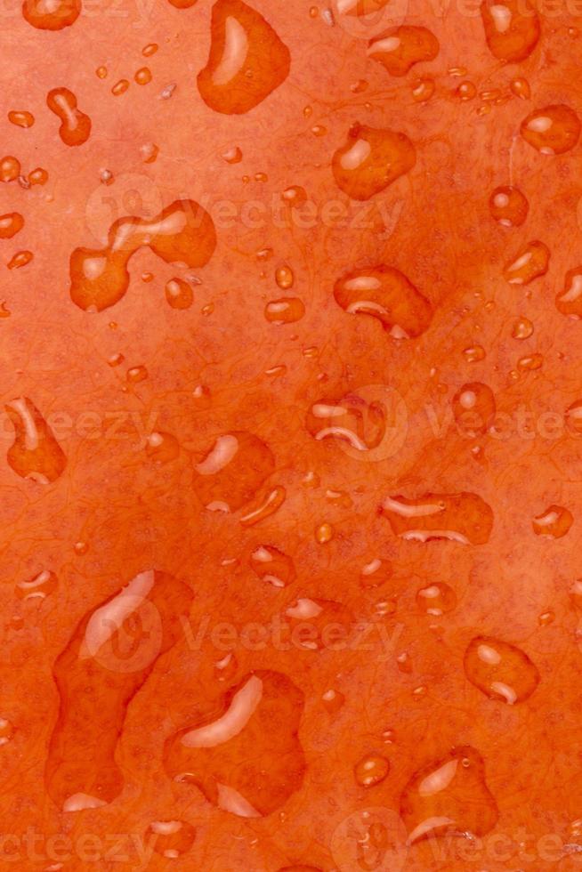 primo piano astratto sfondo testurizzato di una zucca arancione foto