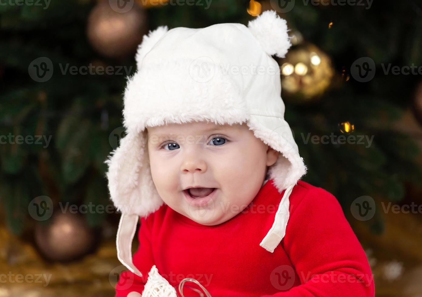 bambino di Natale guardando la telecamera foto