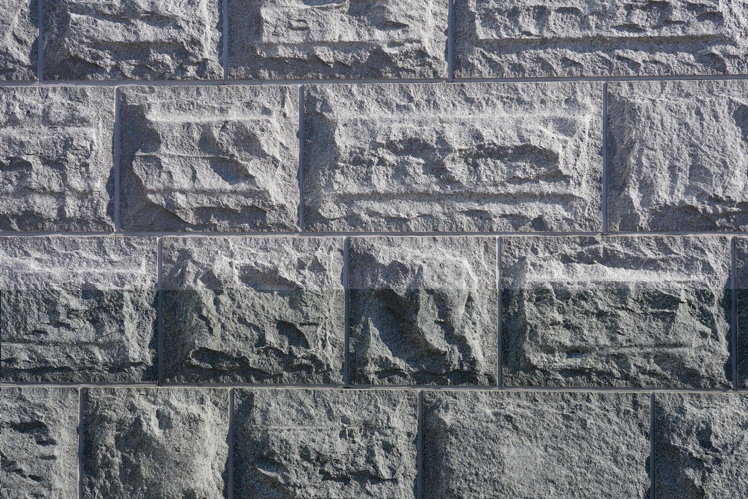 il muro di blocchi di granito è come uno sfondo foto