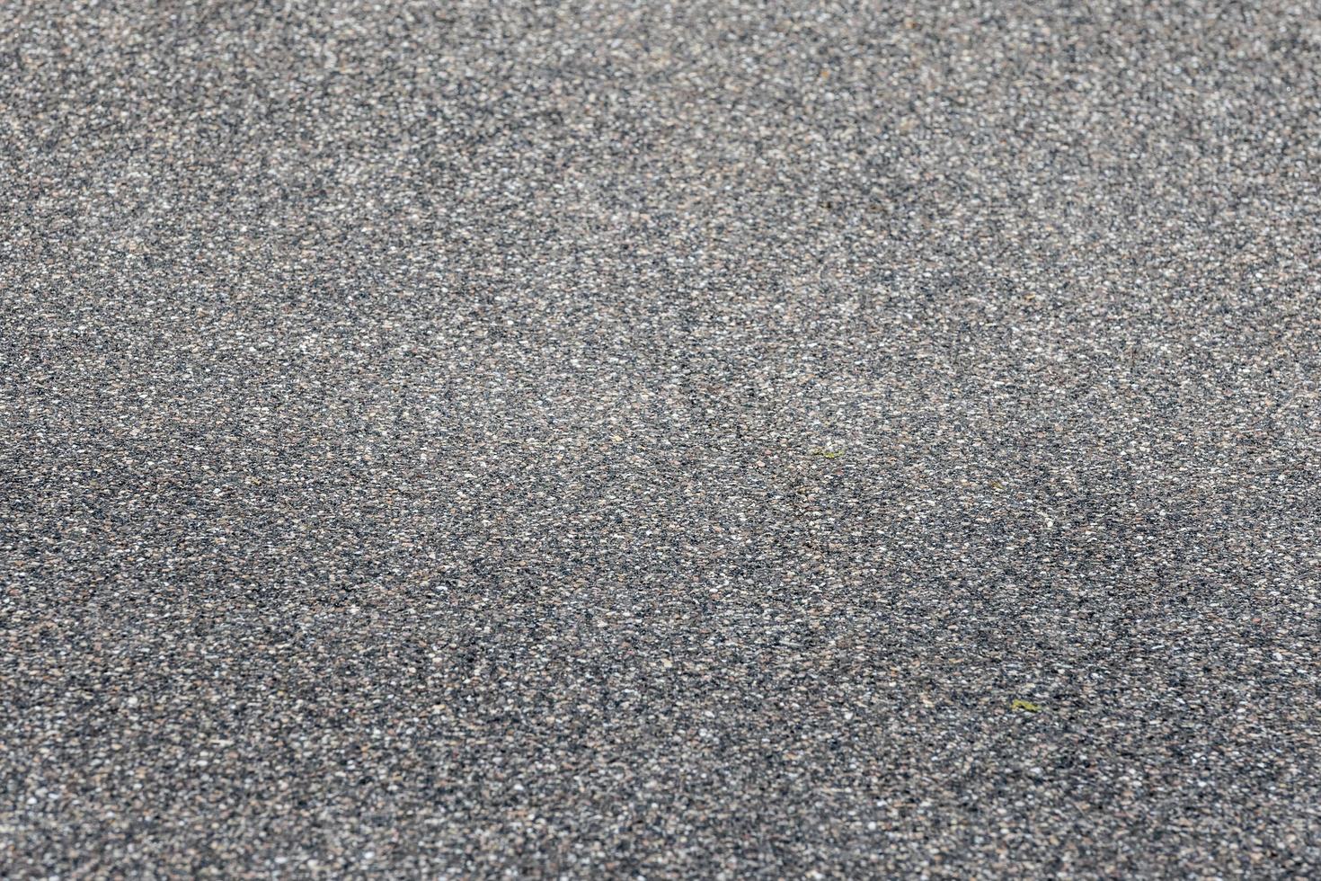 asfalto grigio scuro asfalto rivestito strada come sfondo foto