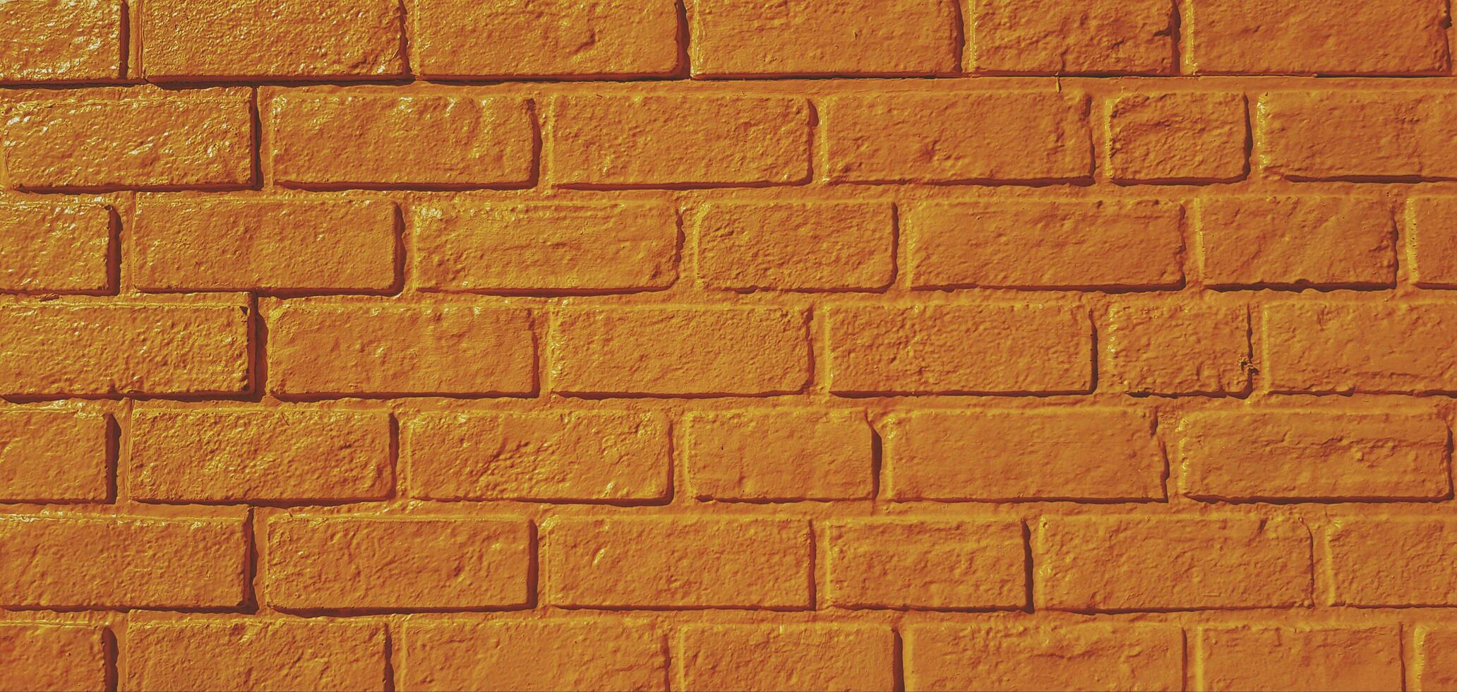 modello giallo mattone parete dipinto per sfondo nel Vintage ▾ tono. arte sfondo e architettura esterno design concetto foto