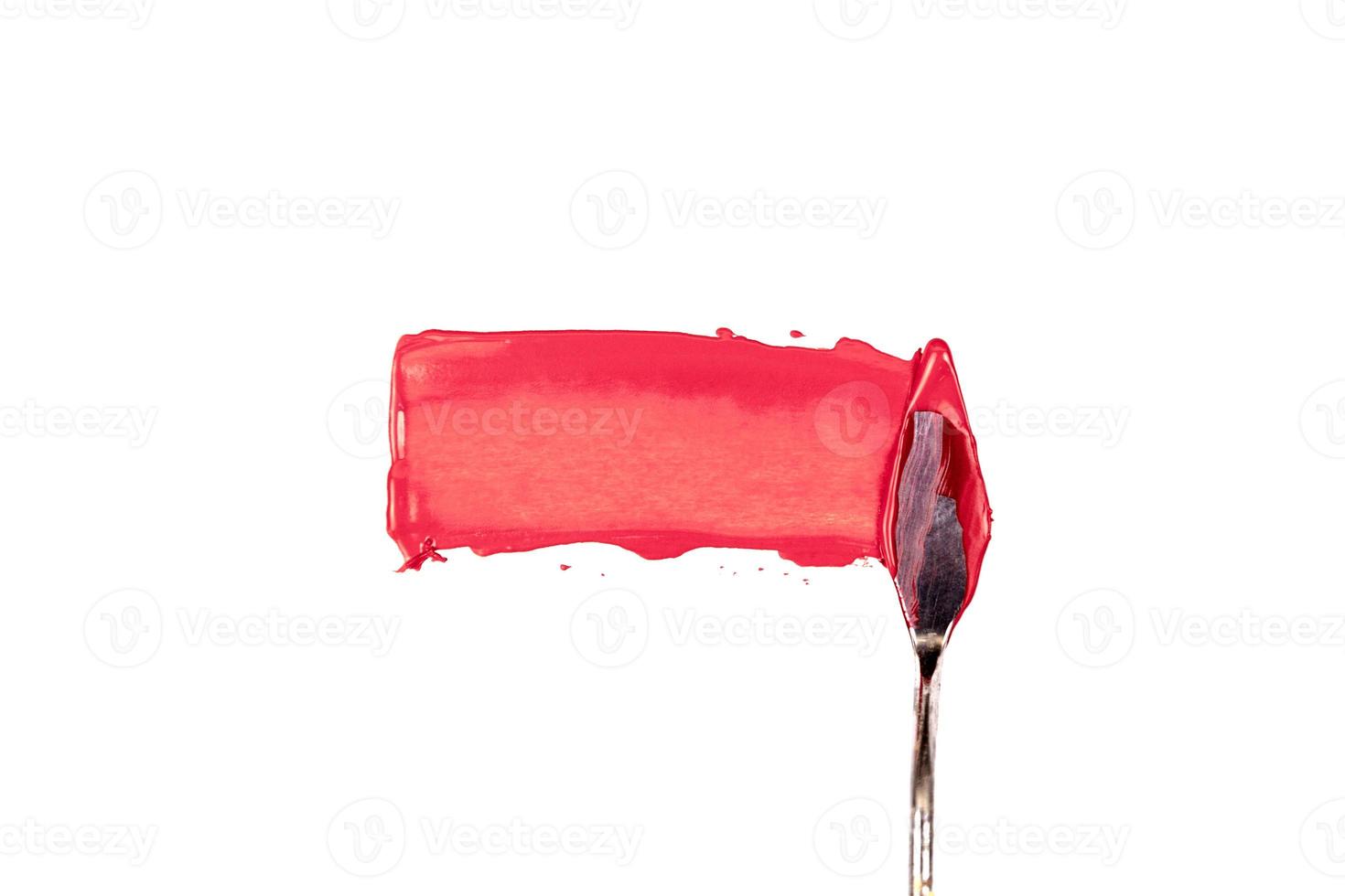 una spatola pittura isolato su uno sfondo bianco con il rosso foto