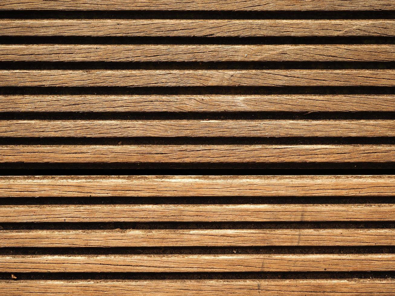 Primo piano di doghe in legno bordo decking ideale per uno sfondo foto
