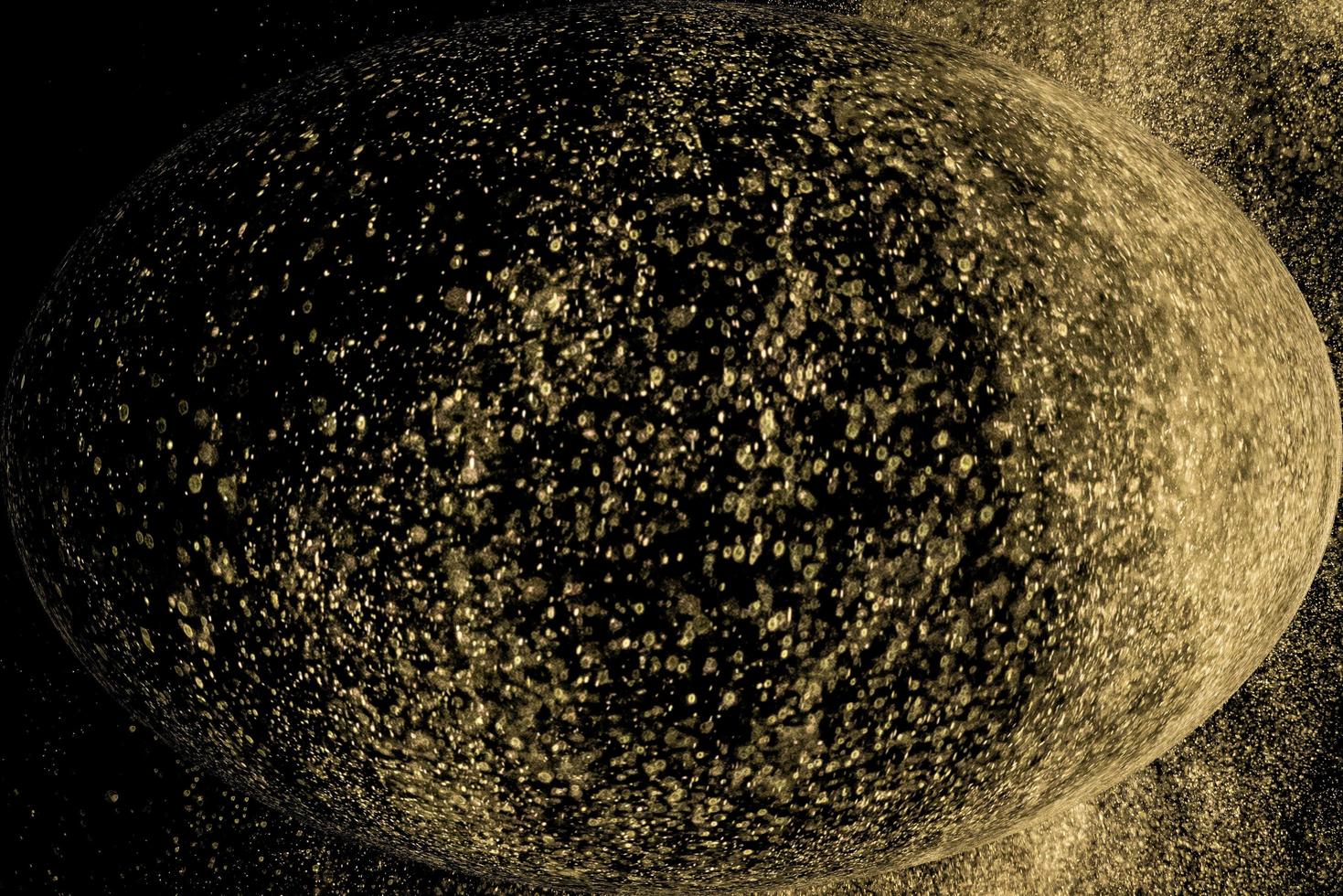 sfera di polvere di stelle d'oro foto