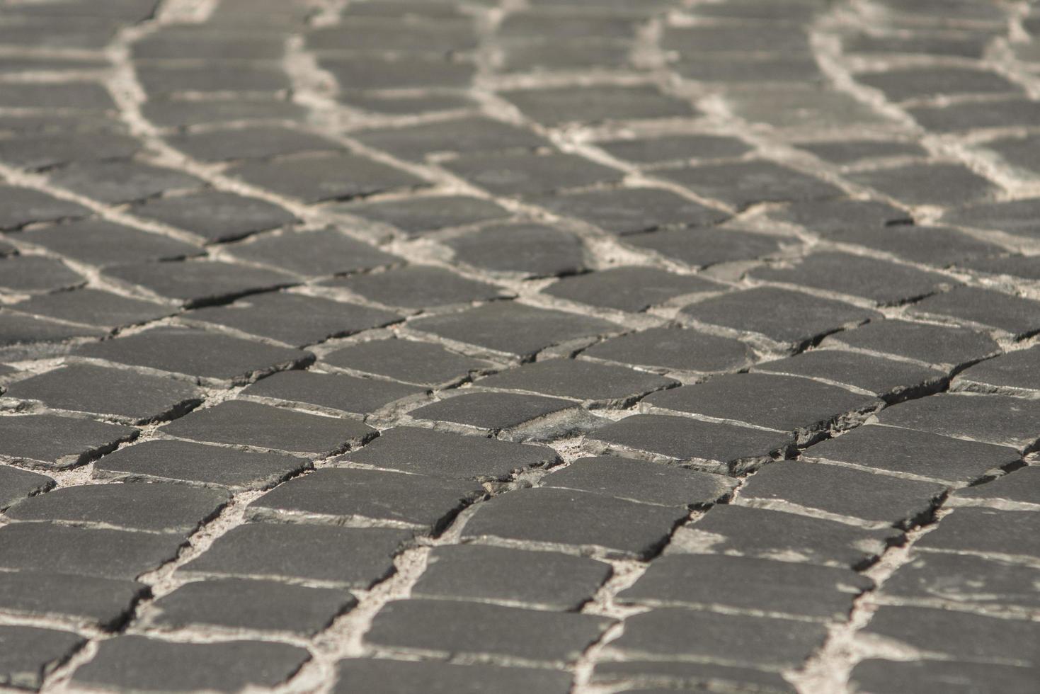pavimentazione nella città vecchia di sfondo nero ciottoli texture wallpaper texture foto