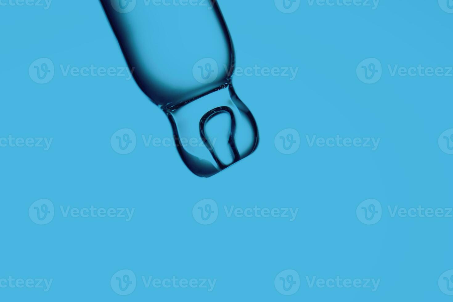 pipetta con un' far cadere di cosmetico Prodotto su un' blu sfondo. foto