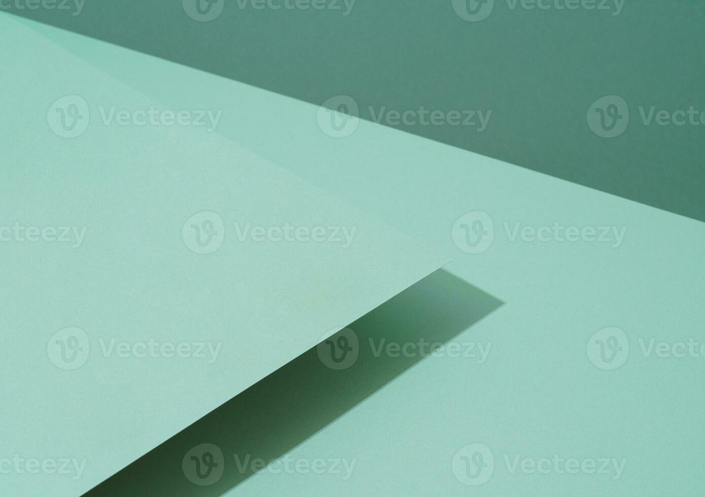 colorato sfondo a partire dal verde carta con ombra. astratto geometrico foto