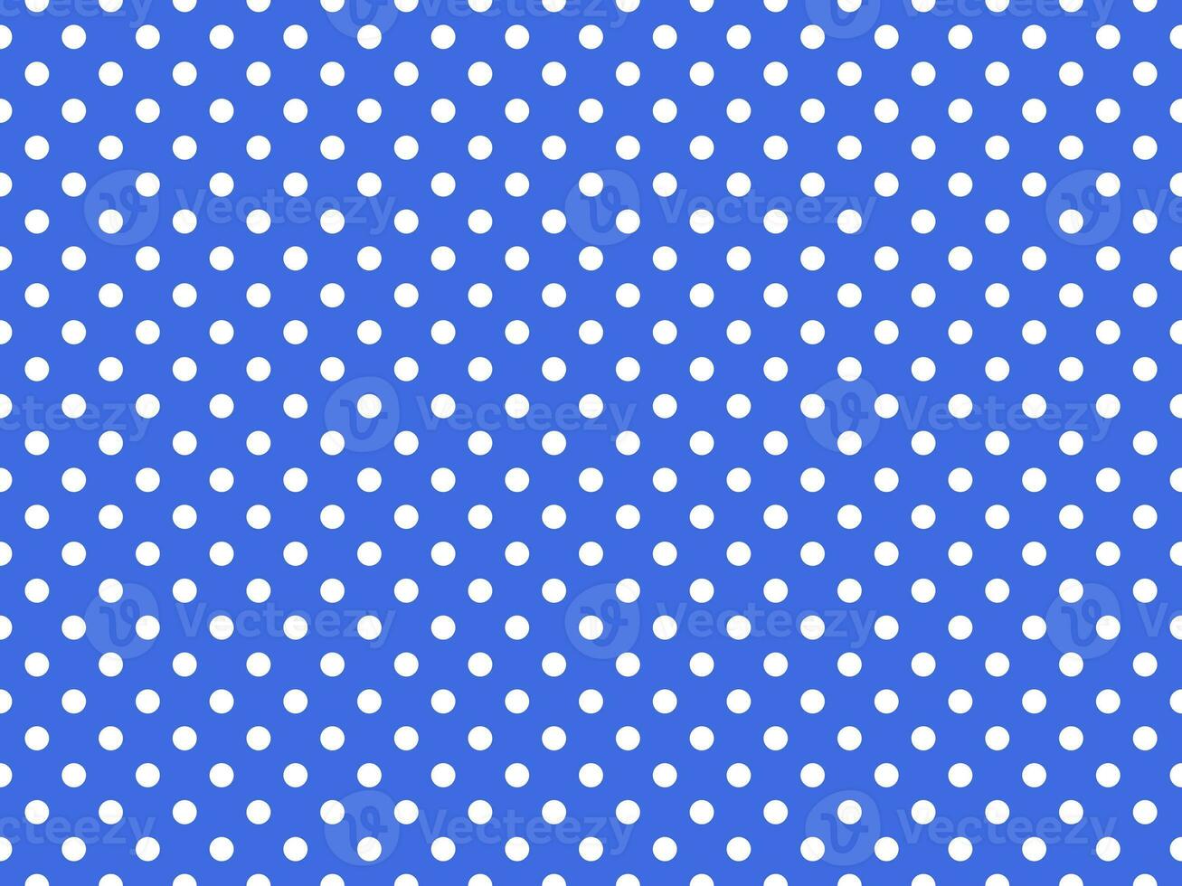 bianca polka puntini al di sopra di reale blu sfondo foto