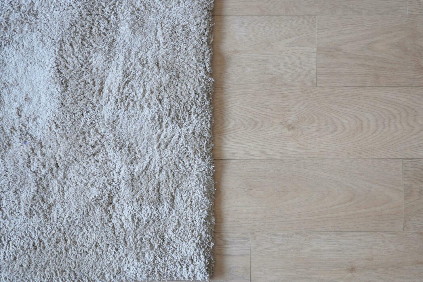 senza soluzione di continuità grigio tappeto struttura sfondo su di legno pavimento con copia spazio foto