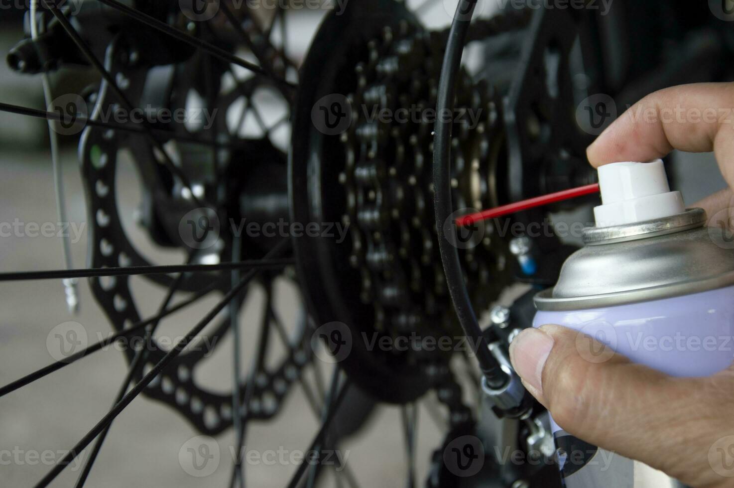 bicicletta Ingranaggio lubrificante spray per impedire ruggine e ridurre umidità. foto