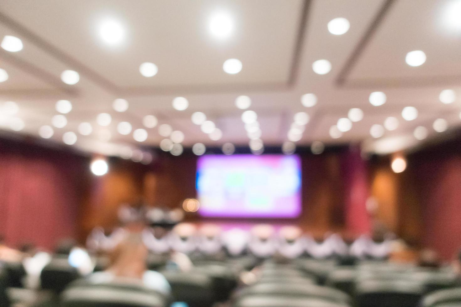 sfocatura astratta sala del pubblico e riunione della conferenza foto