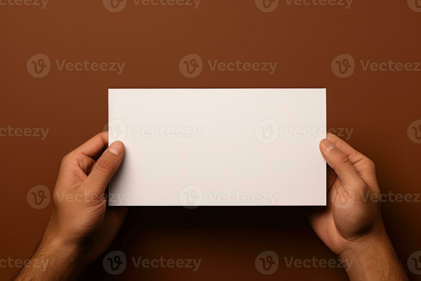un' umano mano Tenere un' vuoto foglio di bianca carta o carta isolato su Marrone sfondo. ai generato foto