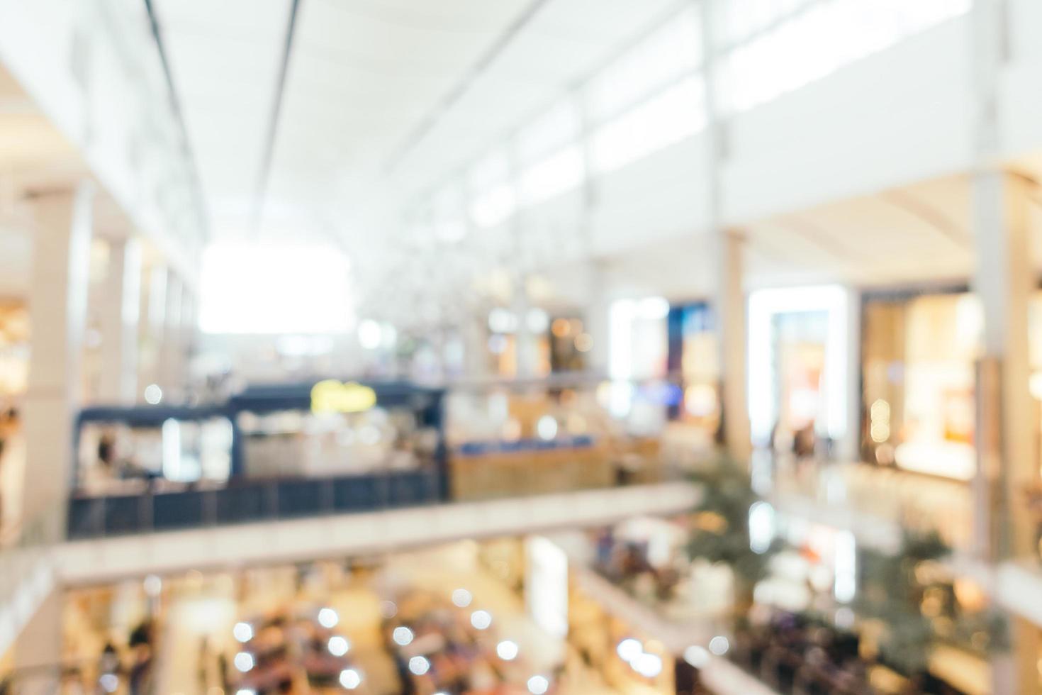 sfocatura astratta e centro commerciale di lusso sfocato dell'interno del grande magazzino per lo sfondo foto