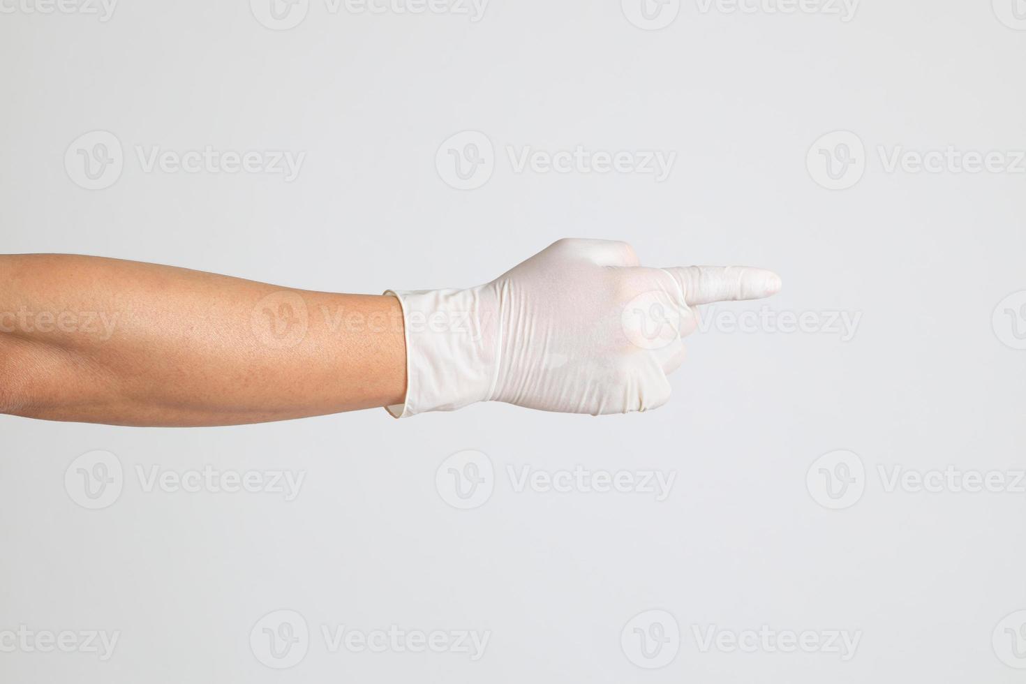 mano con guanti medici foto