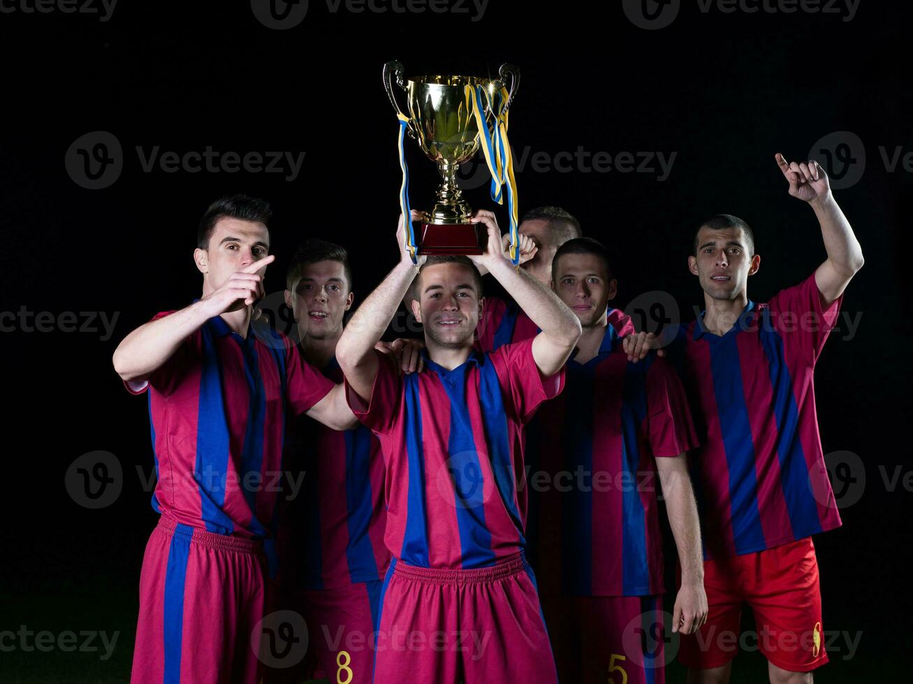 calciatori che celebrano la vittoria foto