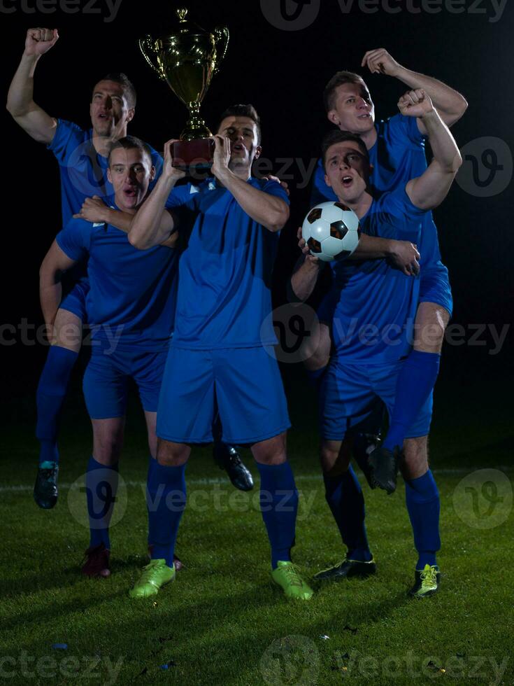 calciatori che celebrano la vittoria foto