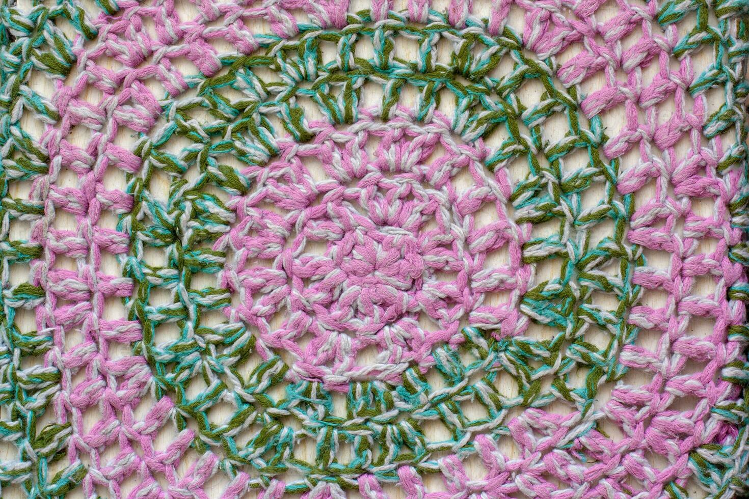 tessuto struttura. a maglia circolare modelli di rosa e verde lana vergine. foto
