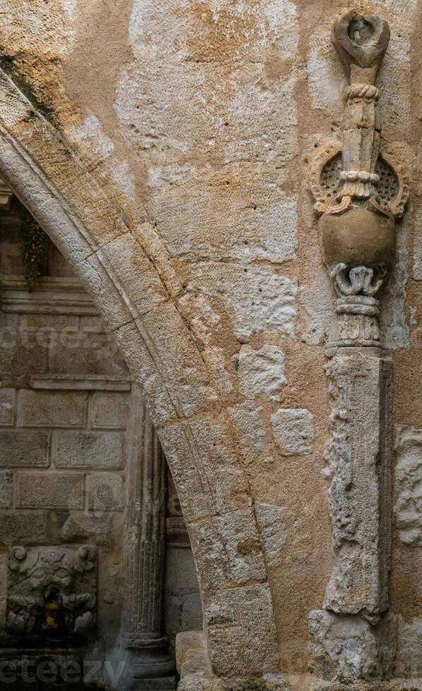 dettaglio su un' antico romano parete nel vecchio cittadina di Rethymno, Grecia foto