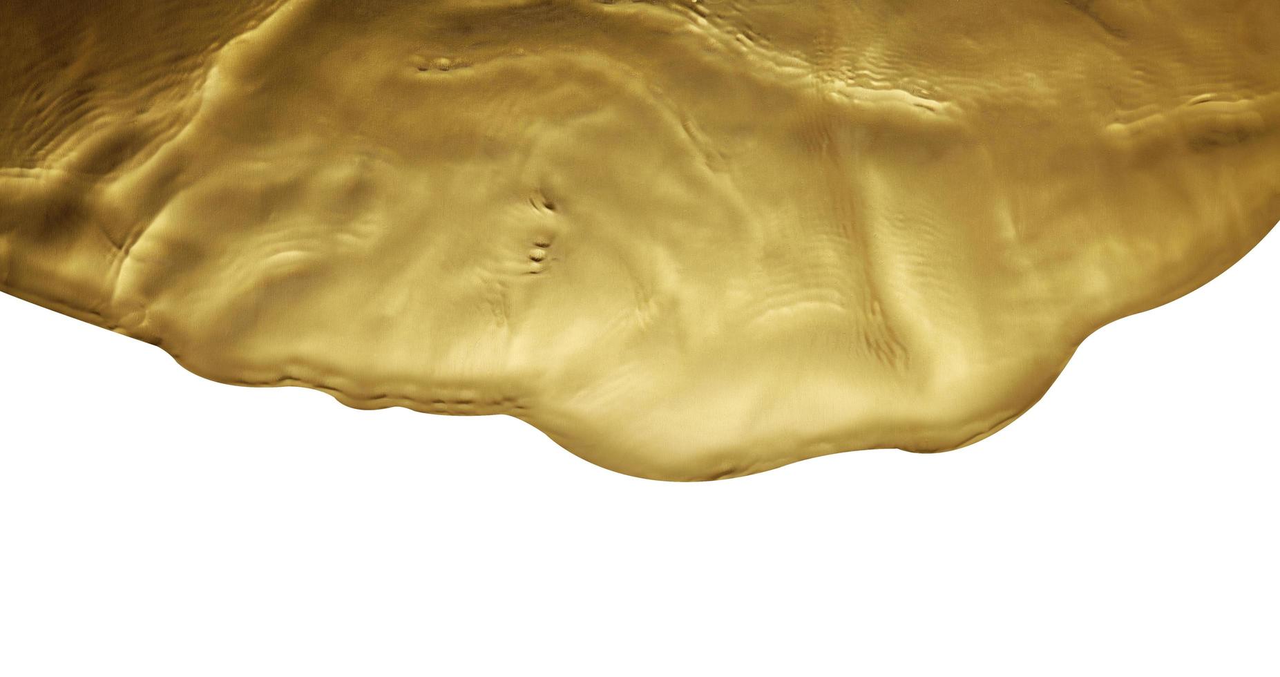 trama di spruzzi d'acqua d'oro su sfondo bianco foto