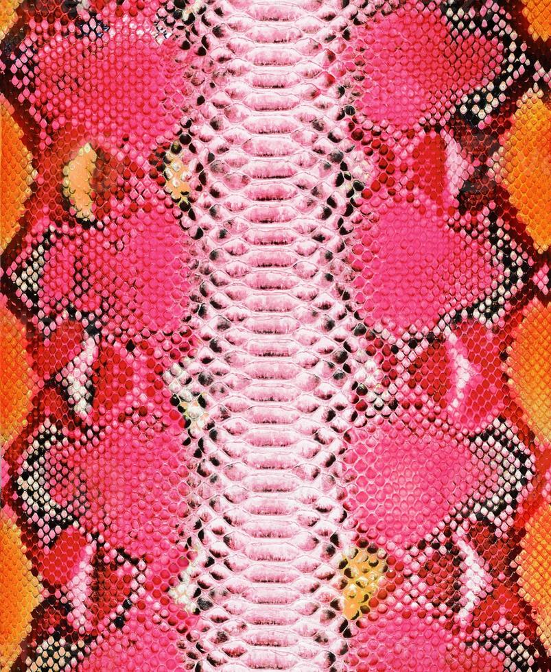 sfondo di pelle di serpente. texture color arancio e corallo foto